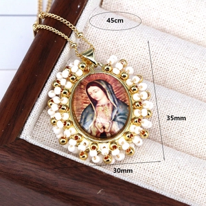 Bohemian Guadalupe necklace with colorful beads and 45cm gold chain on wooden jewelry box