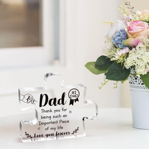 Close-up of puzzle-shaped acrylic plaque with Father’s Day message and floral background