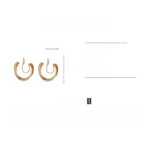 Detailed view of 2cm twisted gold copper clip-on earrings weighing 6.2g for non-pierced ears