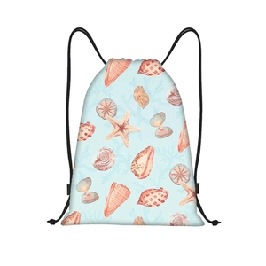 Detail of drawstring backpack showing watercolor sea shell and starfish patterns