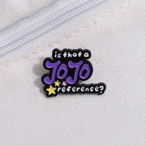 Cartoon JOJO enamel pin badge with colorful stars on a white canvas bag surface