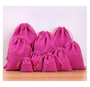 Various sizes of rose red velvet drawstring pouches for jewelry and gift packaging