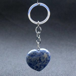 Close-up of heart-shaped blue sodalite stone keychain with silver metal ring and chain
