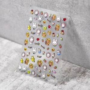 Detailed macro of 5D embossed nail stickers featuring cute cartoon bears and rabbits