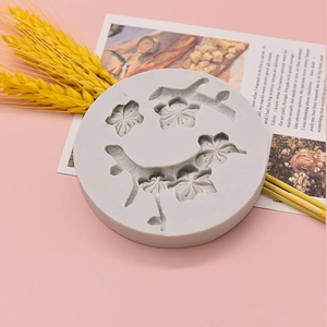 Peach blossom silicone mold for DIY car vents and chocolate crafts on pink background