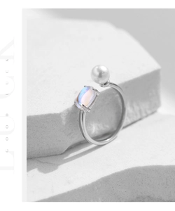 Close-up of S925 sterling silver adjustable ring with moonstone and white pearl