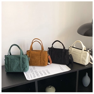 Retro corduroy Boston bags in four colors with adjustable straps and top handles