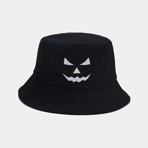 Close-up of a black cotton bucket hat featuring a white Halloween pumpkin face graphic