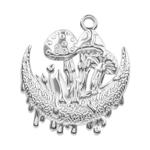 Detailed macro shot of silver crescent moon pendant with three textured mushrooms and ring