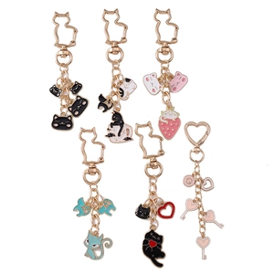 Set of 5 creative cartoon cat keychains with colorful enamel charms and gold hooks