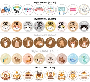 Detail showing 2.5cm round Happy Birthday stickers with colorful animal and bakery designs