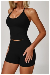 Detail of high-waist seamless black yoga shorts with flexible compression fabric texture
