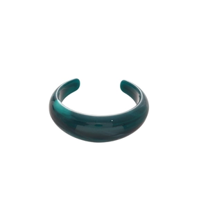 Translucent dark green acrylic open cuff bracelet with marble texture and geometric design