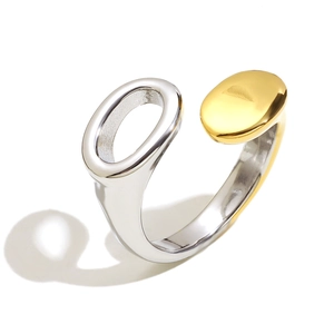 Minimalist two-tone open ring featuring polished gold and silver oval asymmetric design
