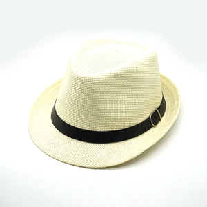 Detail of breathable straw hat texture with black band and silver metal buckle