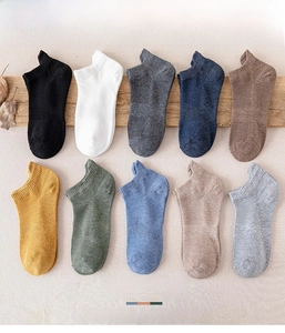 Macro shot of 10 color cotton socks with non-slip silicone heels and knit texture