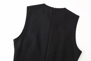 Detail of the back neckline and hidden zipper on this black midi dress