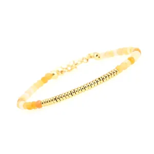 Detailed shot of the gold-plated beads and gradient carnelian stones with lobster clasp