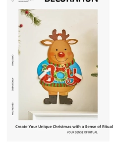 Detailed view of Christmas cartoon reindeer sticker with JOY text and festive scarf decoration