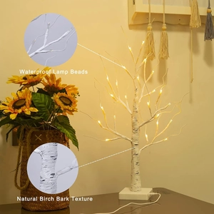 Detail of waterproof LED beads and natural birch bark texture on the decorative tree