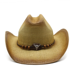 Western straw cowboy hat with bull skull emblem and decorative wooden beads