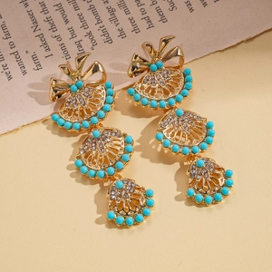 Elegant gold bow fan earrings with sky blue beads and sparkling crystals in retro style