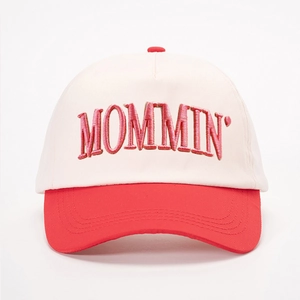 Front view of beige and red baseball cap with MOMMIN' 3D embroidery on plain white background