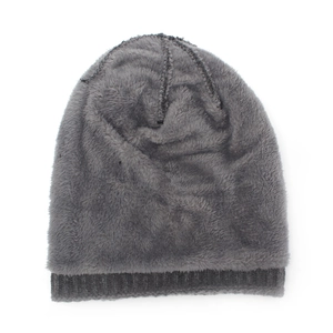 Close-up of thick grey knit beanie with warm plush fleece lining for winter insulation