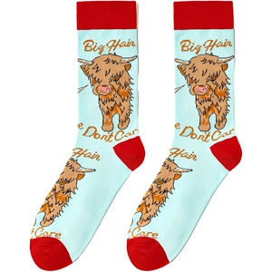 Detail of light blue cotton socks featuring a highland cow cartoon and red heel accents