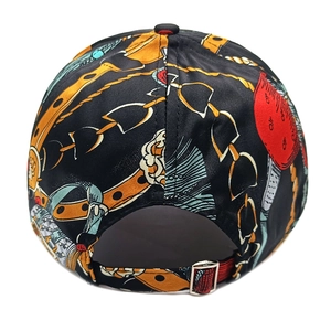 Detail of vintage flower print baseball cap with metal buckle and adjustable red strap