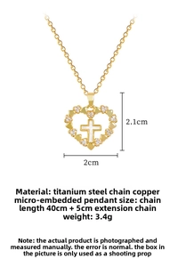 Detailed view of gold heart pendant with cross and pave crystals on 40cm chain