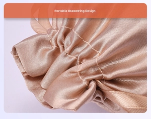 Close-up of portable drawstring design on a champagne gold satin jewelry pouch