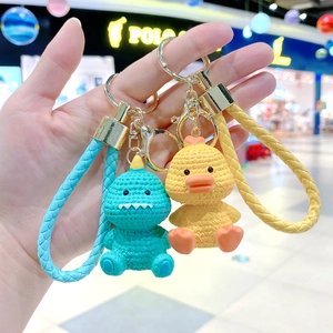 Cute cartoon dinosaur and yellow duck resin keychains with colorful braided wrist straps