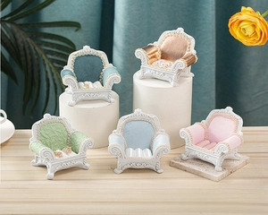 Detailed view of miniature vintage velvet sofa ring displays in five elegant colors