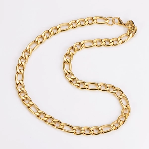 Macro shot of 11mm gold Figaro link chain showing detailed polished stainless steel texture