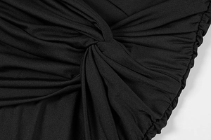 Detailed macro view of black elastic knit fabric featuring knot design and ruching texture