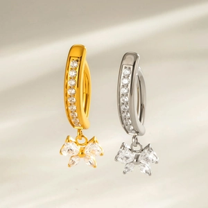 Titanium bow belly button ring with heart zircon pendant in gold and silver finishes