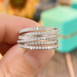 Detailed macro view of a five-layer crisscross ring with pavé set cubic zirconia diamonds