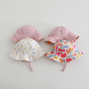 Reversible children's sun hat collection featuring colorful prints and pink chin straps