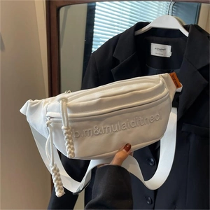White canvas crossbody bag with adjustable wide strap and embroidered letters for women