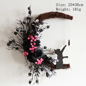 Detail of moon-shaped Halloween cat wreath with black roses and crystal pendant