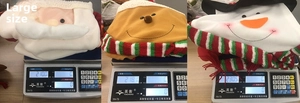 Weight display of large Christmas plush tree topper ornaments on a scale