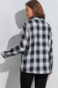 Side view of long-sleeved black and white checkered flannel shirt for women