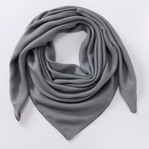 Elegant lightweight grey cotton linen square scarf displayed on a white background