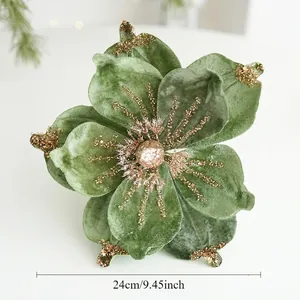 Detailed view of 24cm green velvet magnolia with golden glitter for Christmas decor