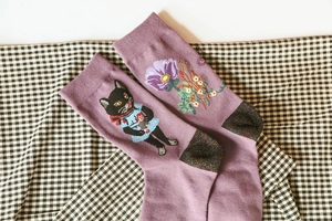 Detailed embroidery of black cat and purple flowers on cotton blend crew socks
