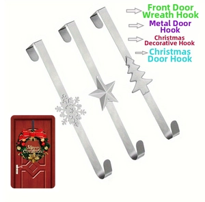Three metal Christmas wreath door hooks featuring snowflake, star, and tree patterns