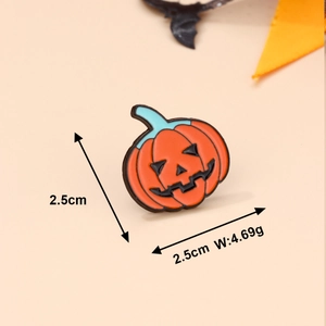 Detail showing orange pumpkin enamel pin size 2.5cm by 2.5cm with weight specifications