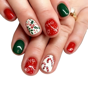 Classic Christmas short press-on nails with red berries, green leaves, and Ho Ho Ho text