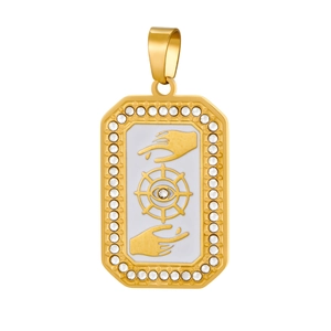 Detailed macro of a rectangular gold-plated pendant featuring eye and hand motifs